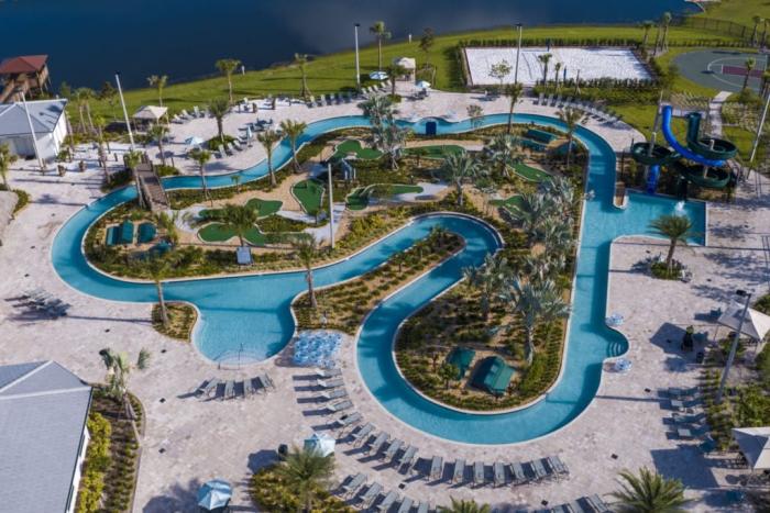 Direct overhead aerial view of the looping lazy river, water slide, and mini golf course