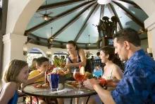 Family enjoying ameal at the Beach Club Restaurant, Universal's Hard Rock Hotel