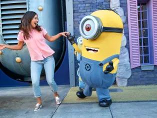 A woman dancing with a minion at Universal Orlando