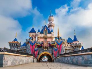 Sleeping Beauty Castle adorned with 70th anniversary flags and decorations