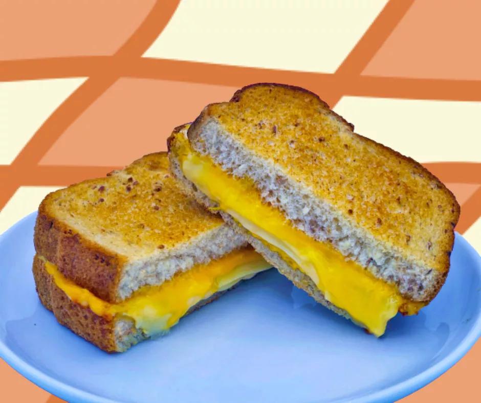 A sliced grilled cheese sandwich