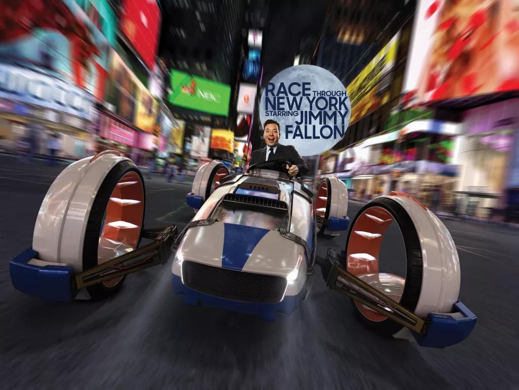 Promotional image of Jimmy Fallon in a race vehicle going through New York