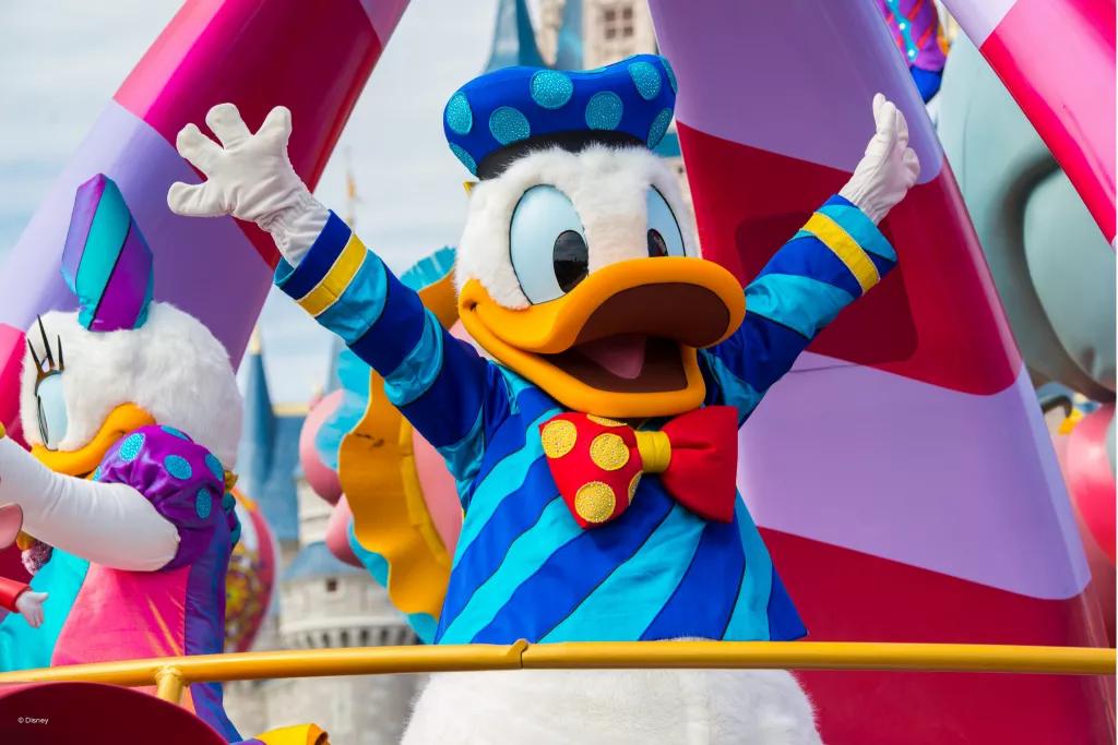 Donald Duck holding his hands up during the Festival of Fantasy Parade