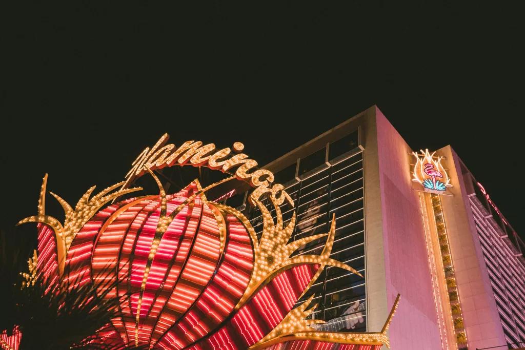 The outside of the Flamingo Hotel and Casino with a large illuminated sign