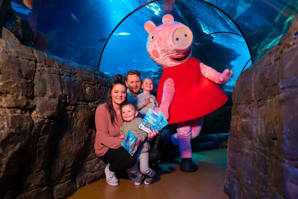 A family meeting Peppa Pig at SEA LIFE London