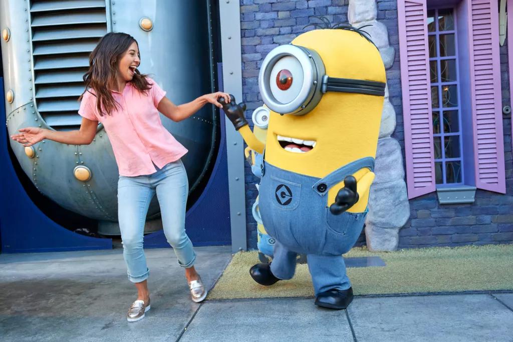 A woman dancing with a minion at Universal Orlando