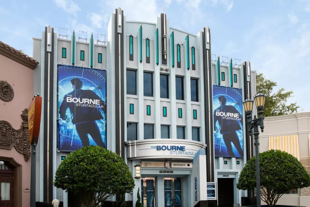 The exterior building for the Bourne Stuntacular with posters of Jason Bourne