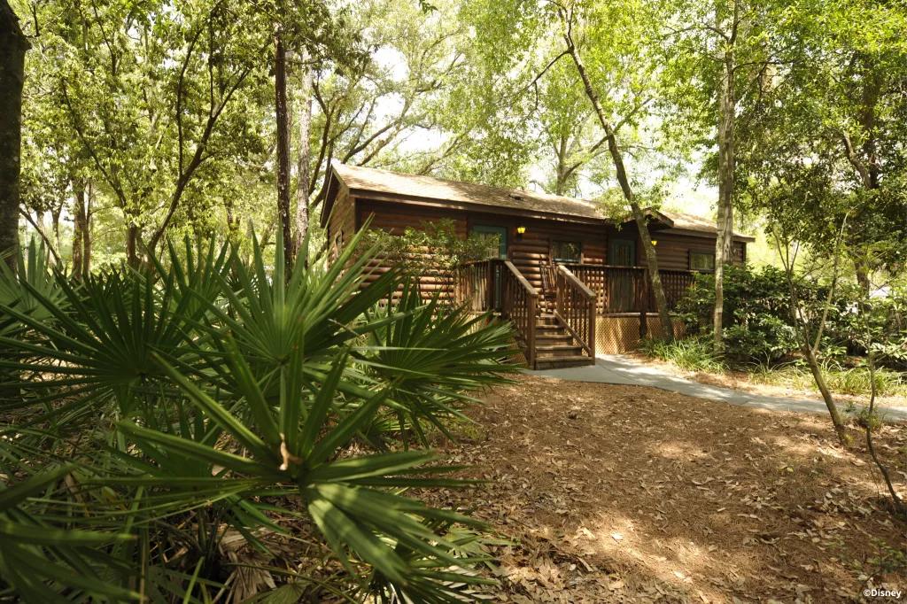 A log cabin surrounded by trees at Disney's Fort Wilderness Resort
