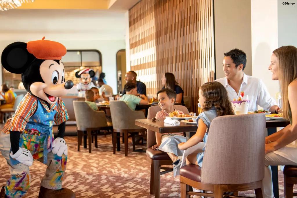 Mickey Mouse meeting guests dressed as a French painter
