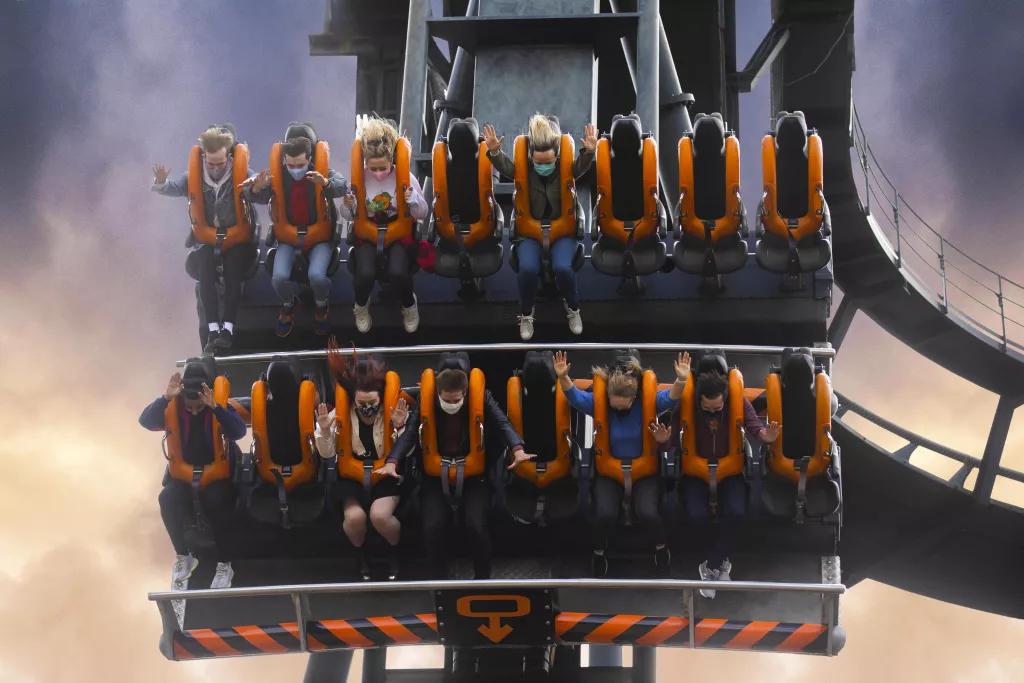 Guests on Oblivion facing downwards in a ride vehicle on the 90 degree drop 