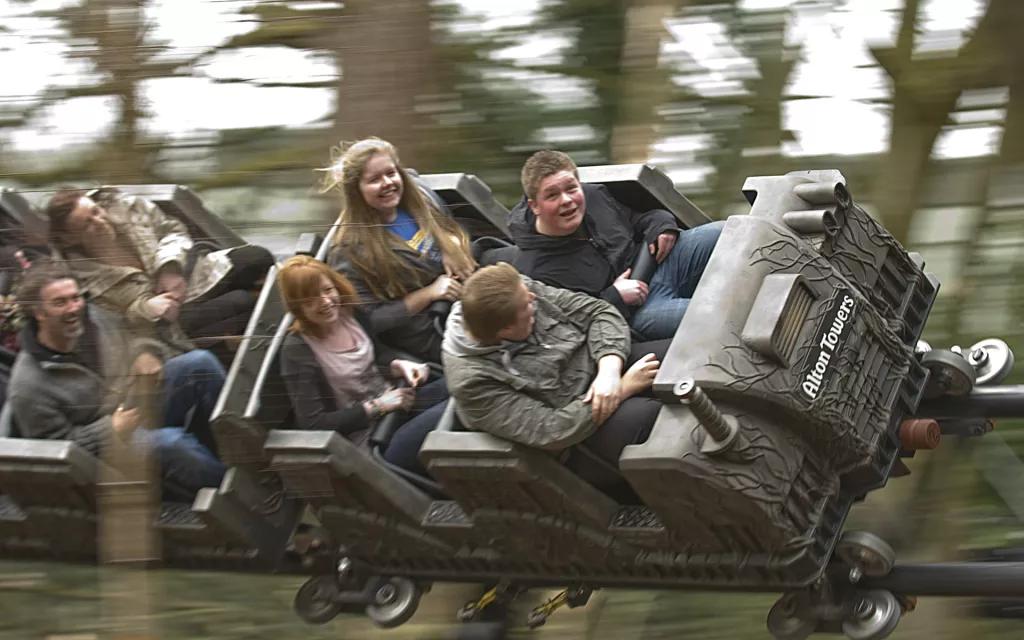 Teenagers riding a roller coaster