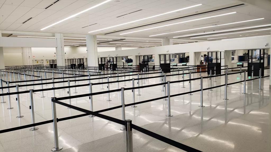 A series of queues set up ready for passengers at the security area of Terminal C