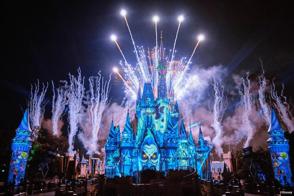 Cinderella Castle projected with Disney Villains with fireworks in the background