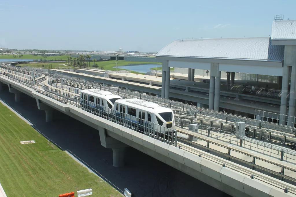 An automated tram taking passengers between terminals at Orlando International Airport