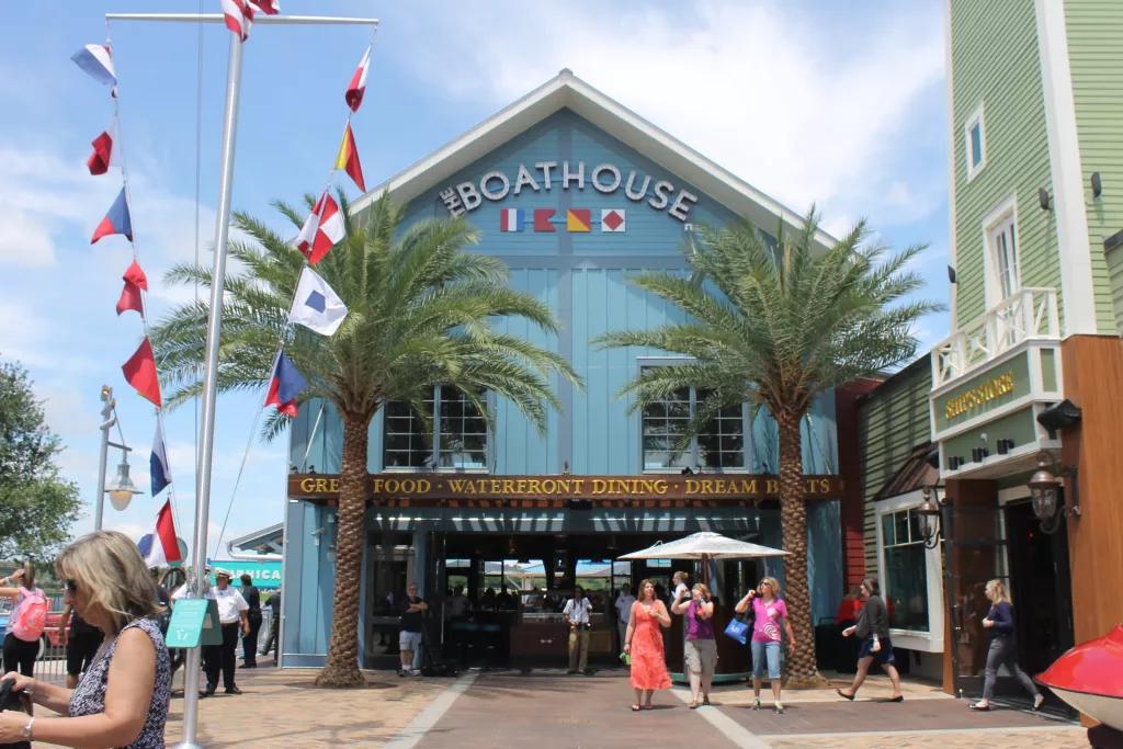 The entrance to Boathouse restaurant clad with blue panels and decorated with sailing flags