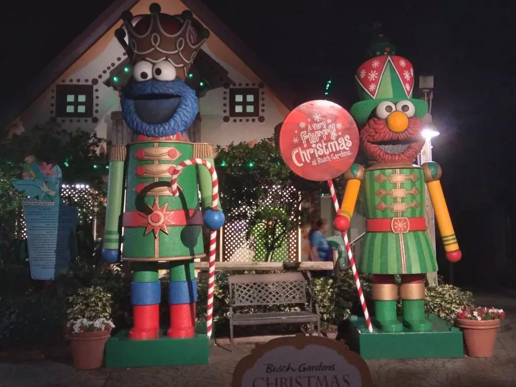 Statues of Elmo and Cookie Monster dressed as Christmas nutcrackers