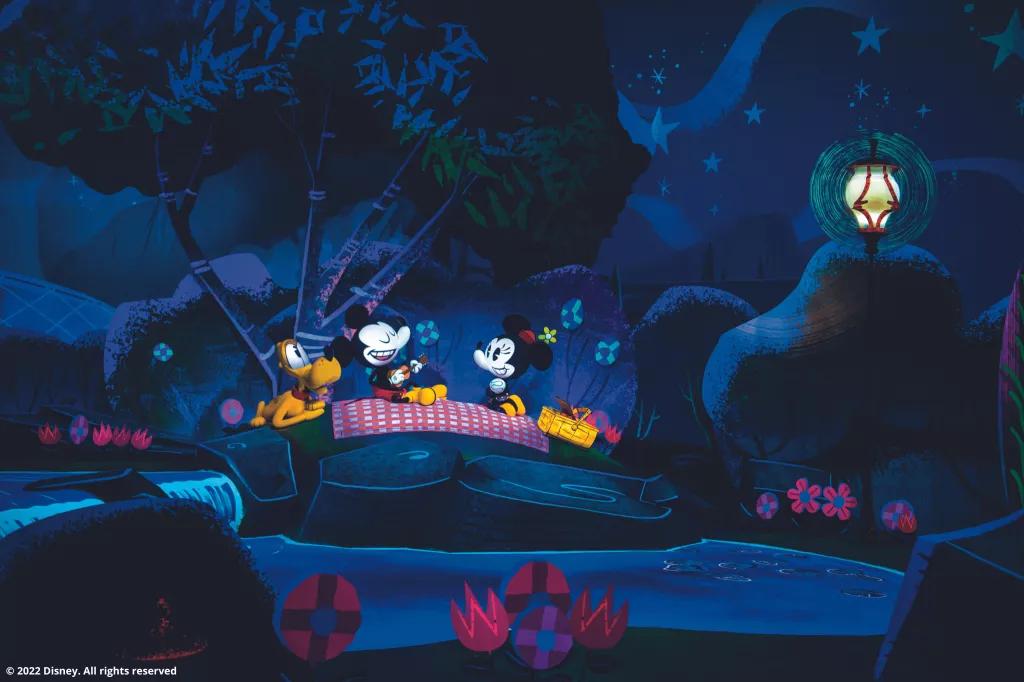 Animatronics of a stylised Mickey, Minnie and Pluto sat on a picnic blanket