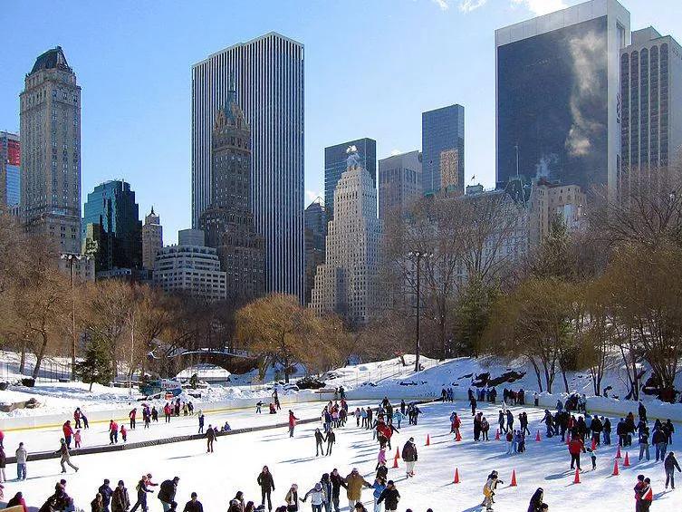 Looking down over the Woolman Ice Skating Rink in Central Park with skyscrapers in the background