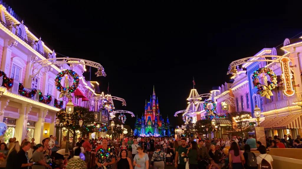 Main Street USA at Magic Kingdom decorated for Christmas with wreaths and lights on Cinderella Castle