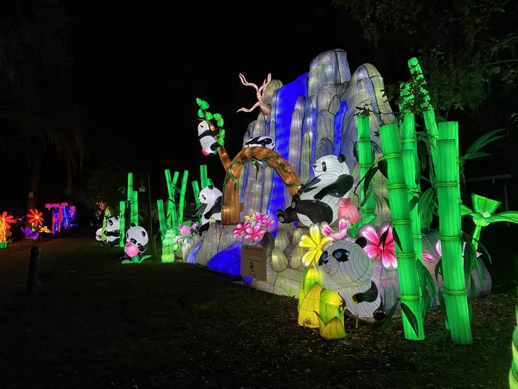 A rocky waterfall with pandas and bamboo made from Chinese lanterns