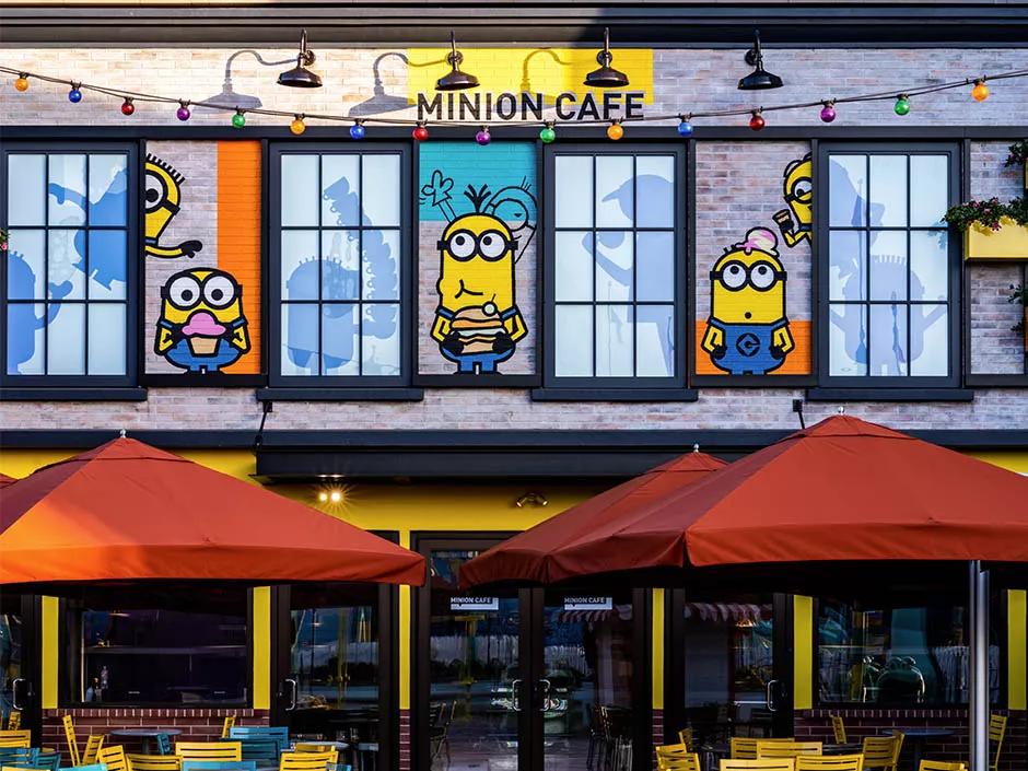 The exterior of the Minions Cafe at Universal Studios Hollywood, featuring cartoon images of Minions
