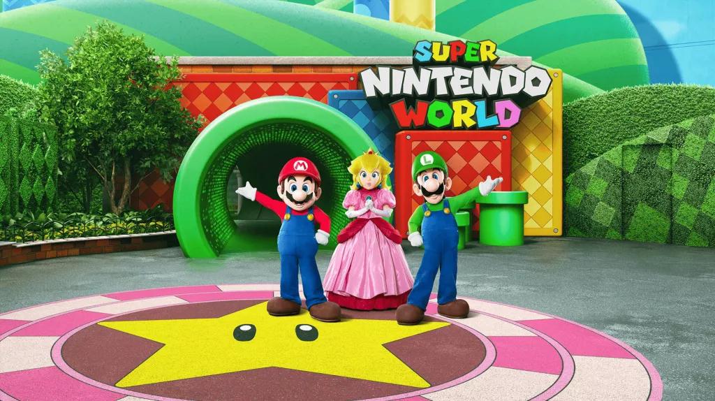 An artist rendering of Mario, Luigi and Princess Peach standing in front of the entrance to Super Nintendo World at Universal Studios Hollywood
