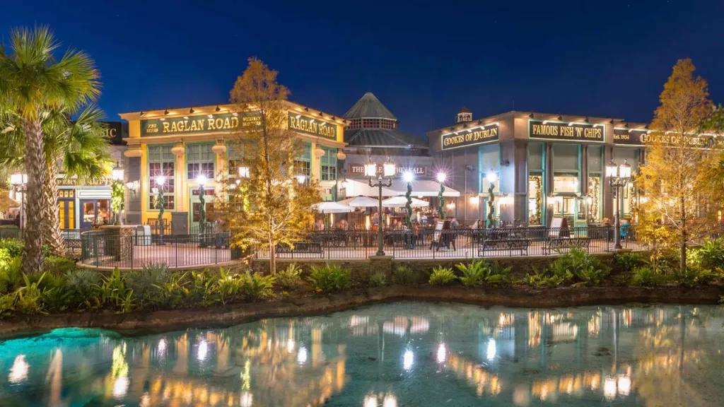 Raglan Road pub lit up at night on the other side of the water at Disney Springs