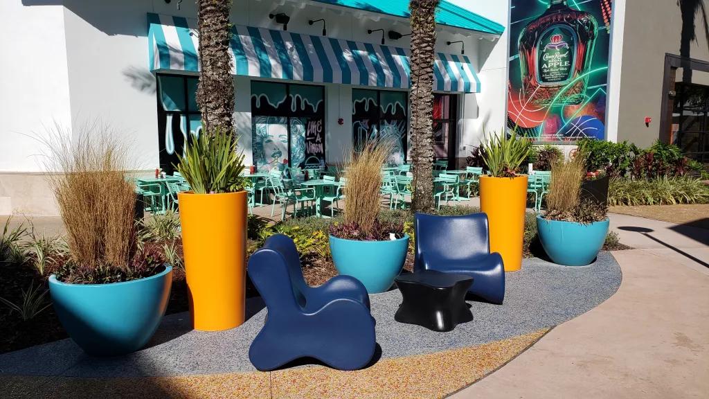 The exterior of JoJo's ShakeBar with outdoor seating lined with plants