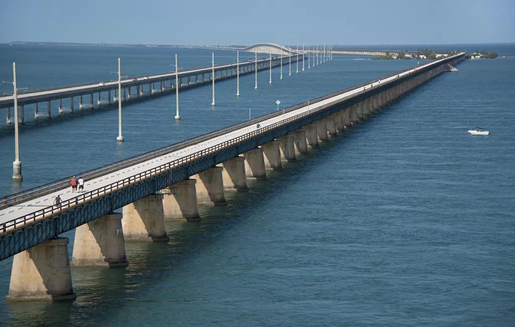 Two long concrete bridges going from one island to another over the ocean