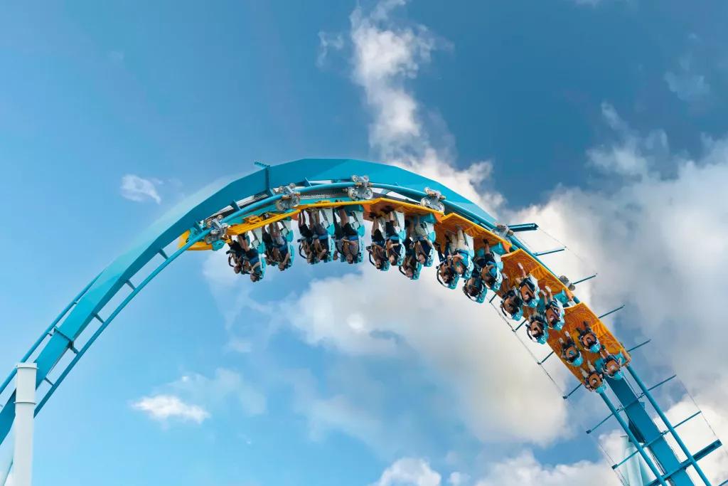 A rollercoaster inversion in front of a blue sky