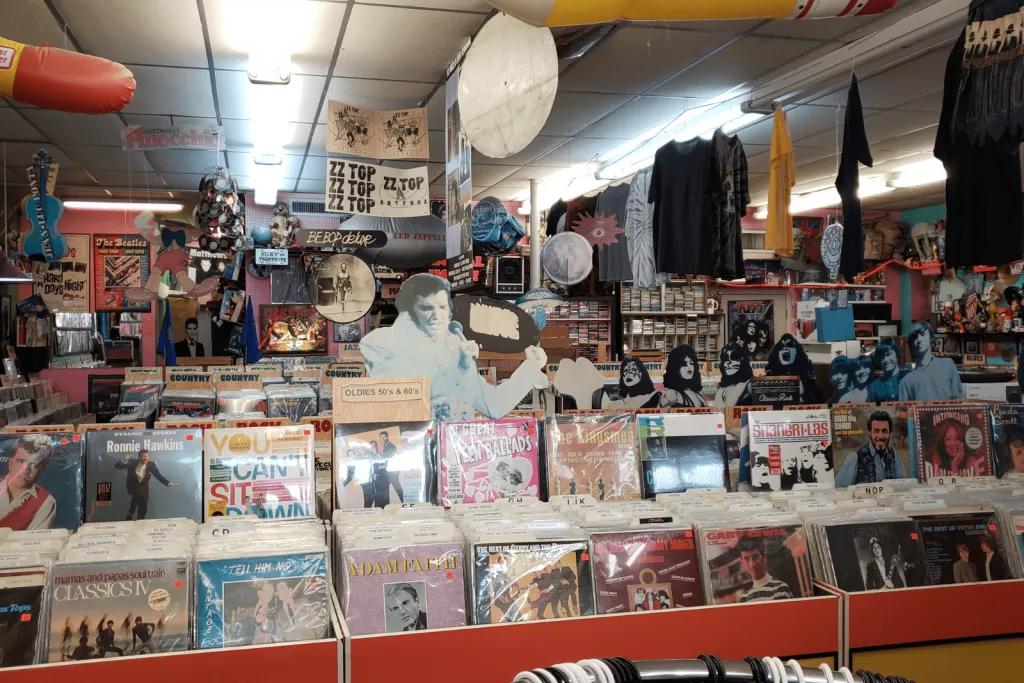 A record shop with rows of rock and roll vinyls on display