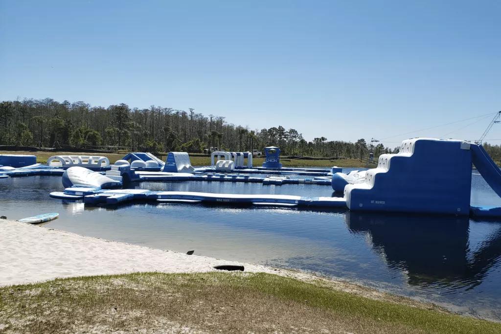 An aquatic climbing course of inflatable rafts on a large expanse of water