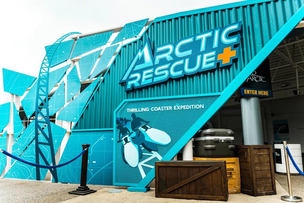 The exterior of a building designed to look like a teal shipping container with Arctic Rescue written on the side