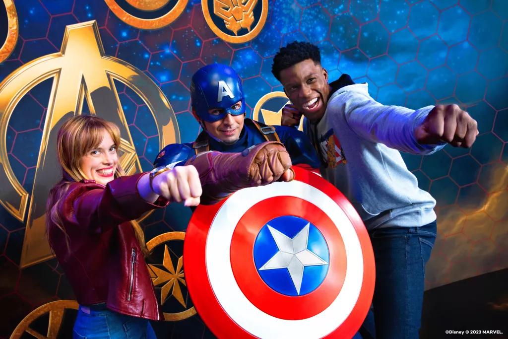 A man and a woman posing for a photo with Captain America