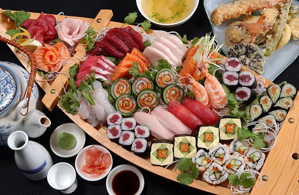 A wooden boat full of sushi