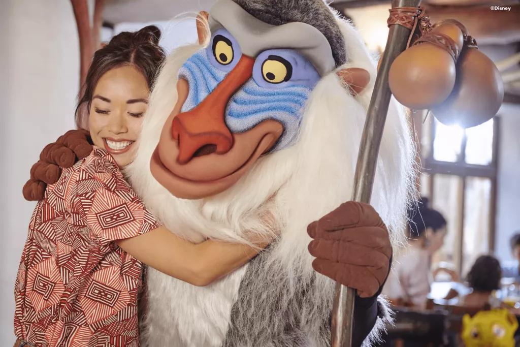 A woman hugging Rafiki 