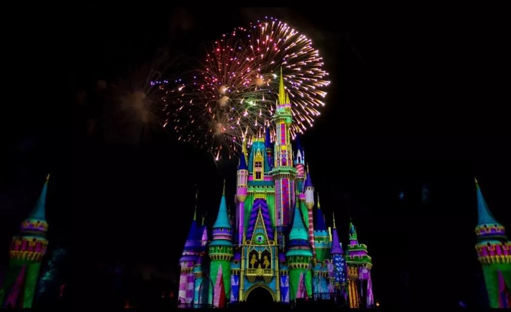 Cinderella Castle lit with projections and fireworks