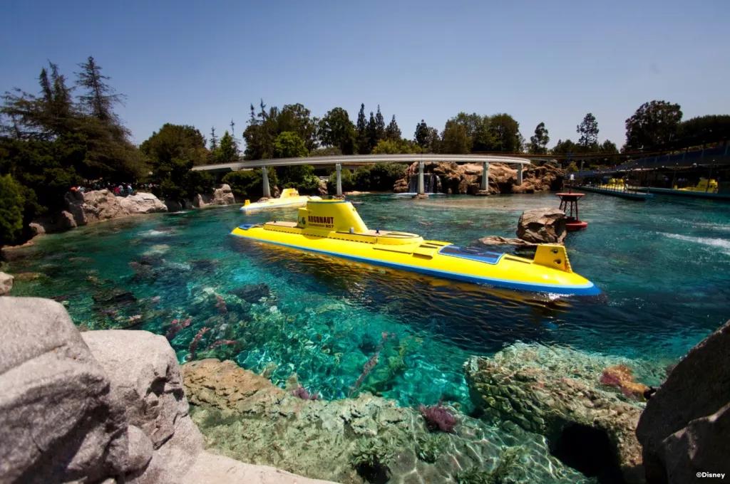 A bright yellow submarine on the surface of a lagoon with clear blue water