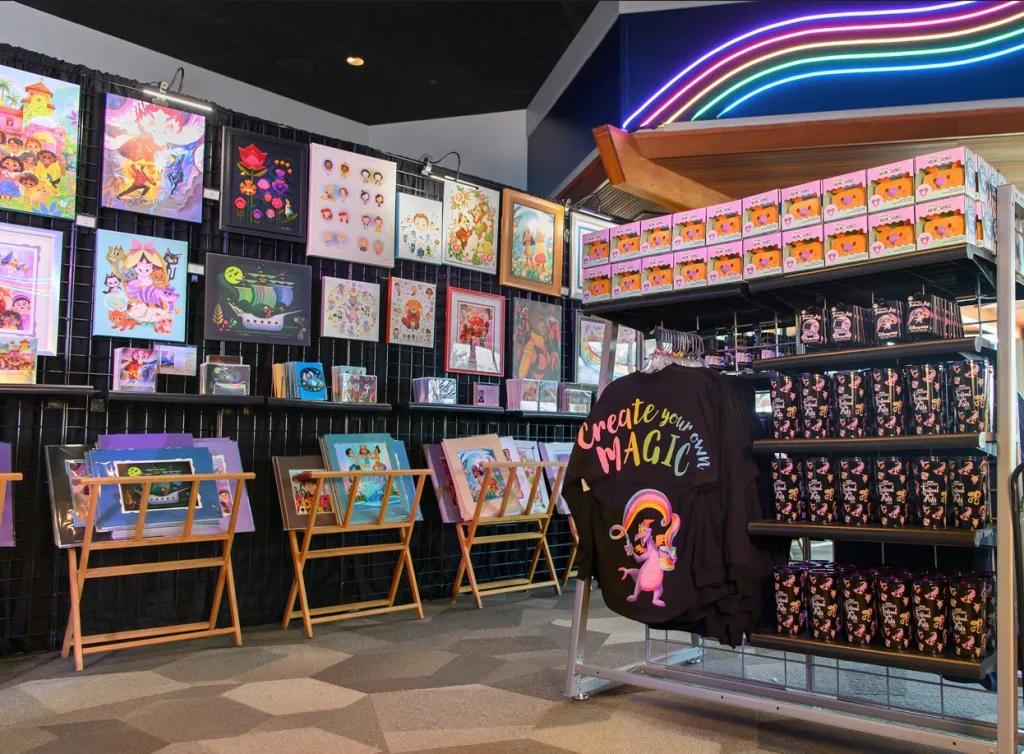 A shop filled with art for sale and colourful Disney-themed merchandise