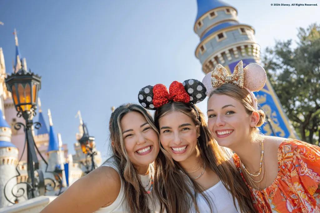 3 adults in front of the castle