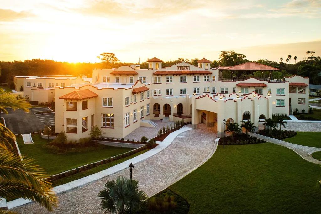 A Mediterranean style hotel building at sunrise