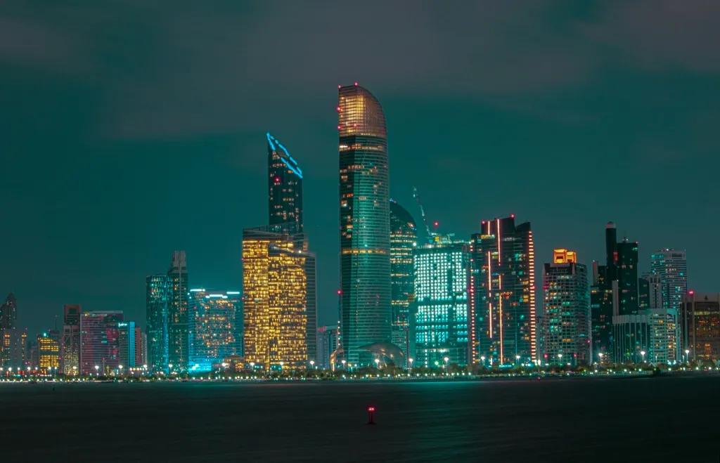 Evening view of Abu Dhabi of the skyline with many tall skyscrapers