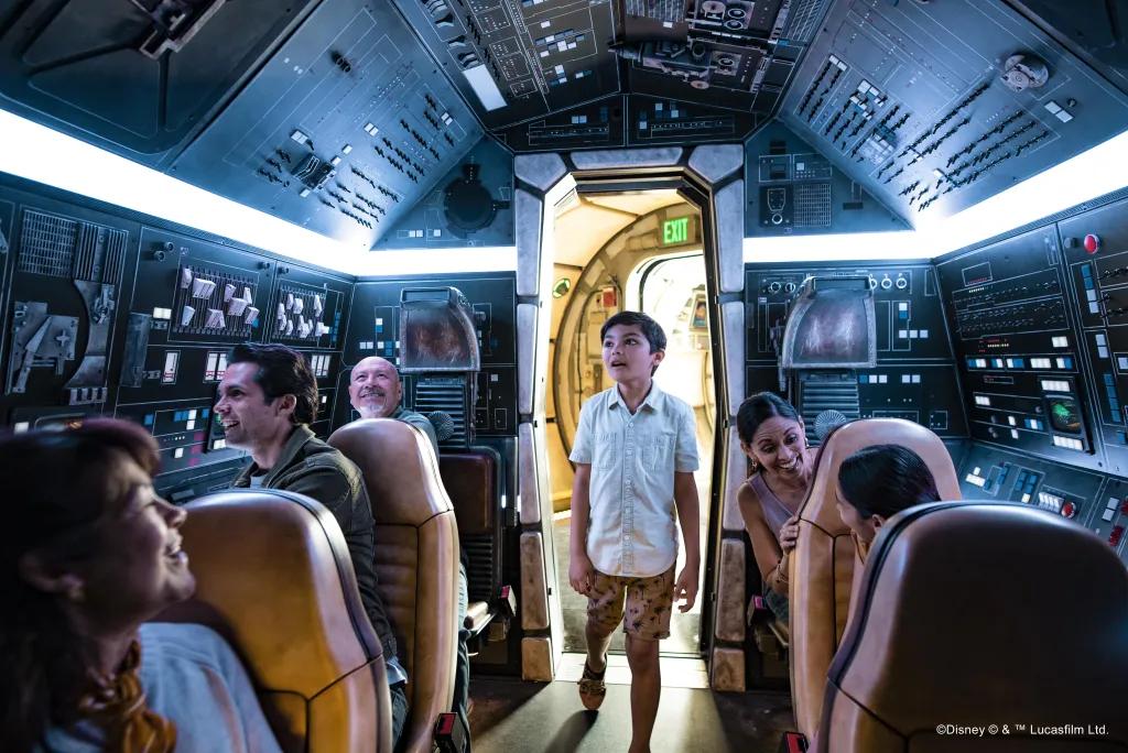 A young boy walking onto the Millenium Falcon Smugglers Run attraction