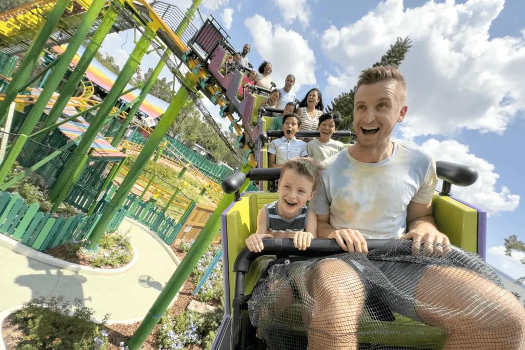 A father and son riding at the front of a rollercoaster
