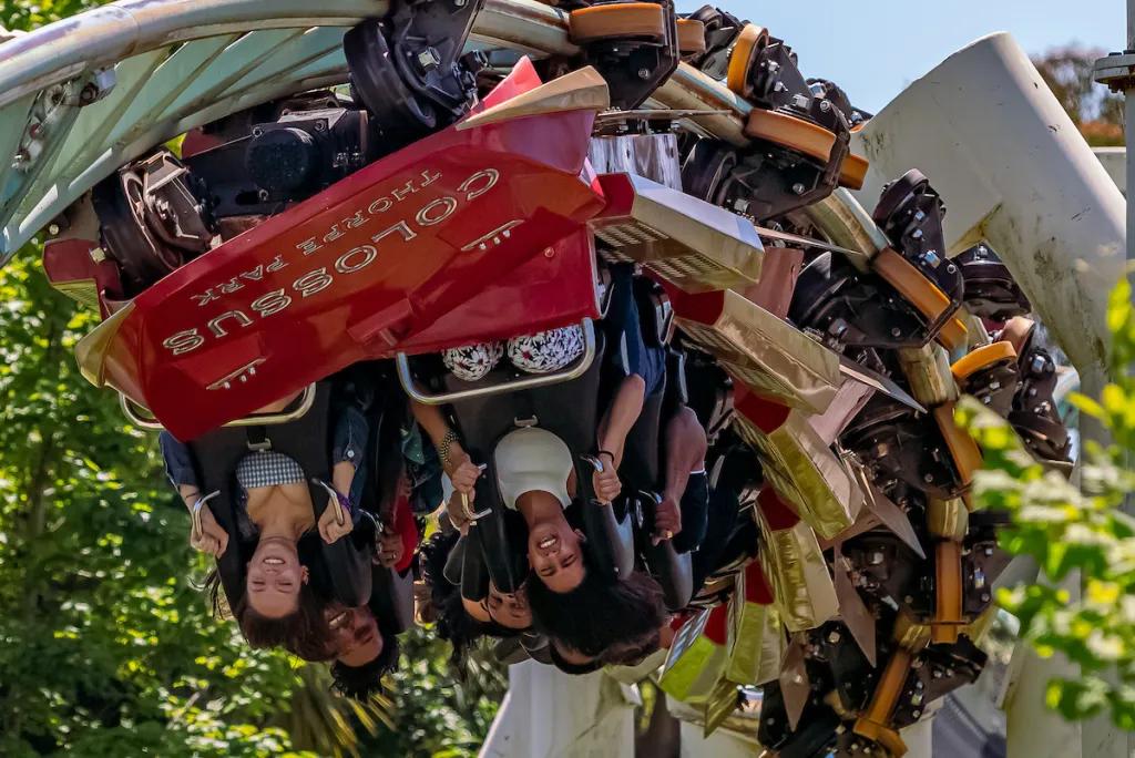 A roller coaster turning upside down on an inversion