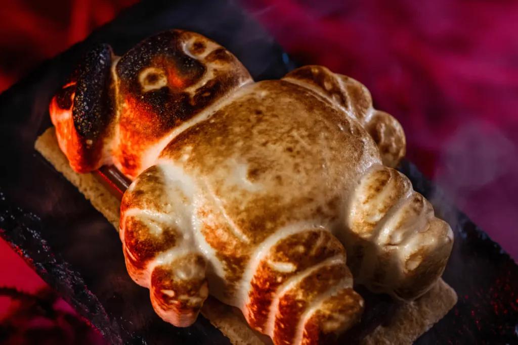 A s'more with a toasted marshmallow shaped to look like the Stay-Puft ghost from Ghostbusters
