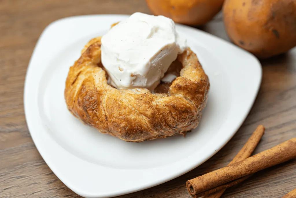 An apple galette topped with vanilla ice cream