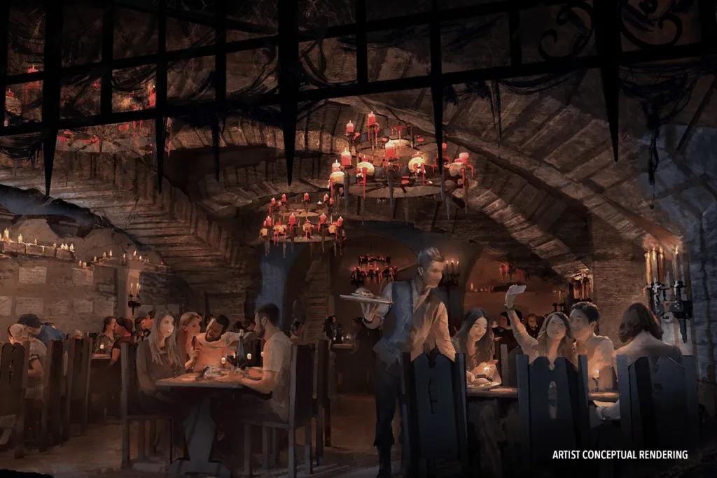 A dark lit restaurant with a castle style with a spikey gate lifted up and old lights.