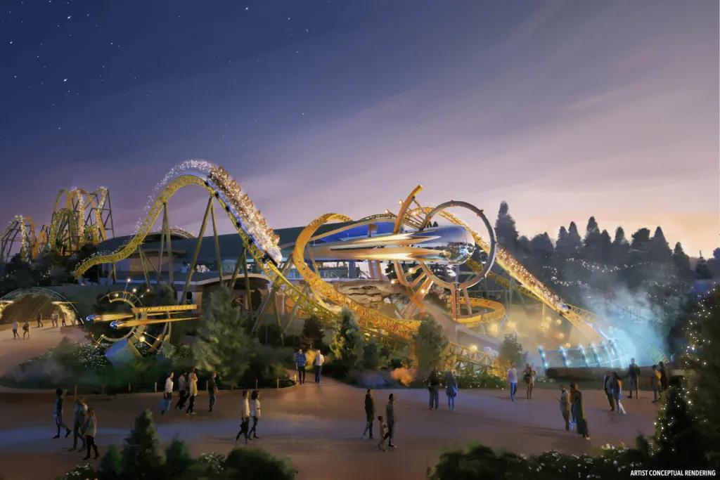A large duelling rollercoaster with yellow tracks and a space theme.
