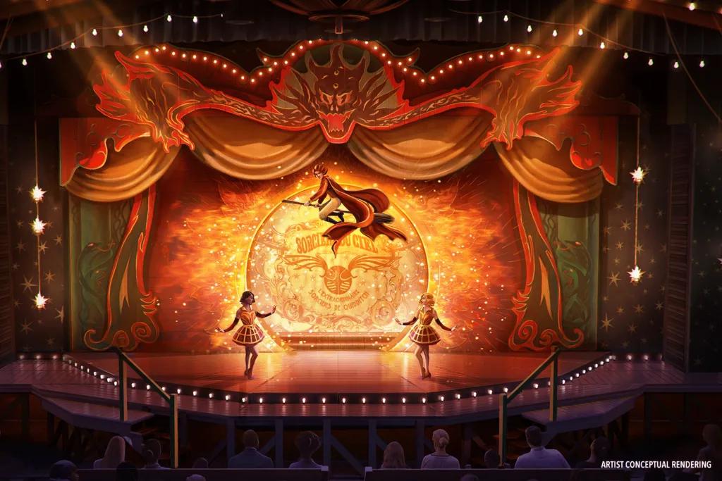 A tent styled building with two circus dressed women stood on either side of the stage. There is also a wizard on a broomstick flying overhead.